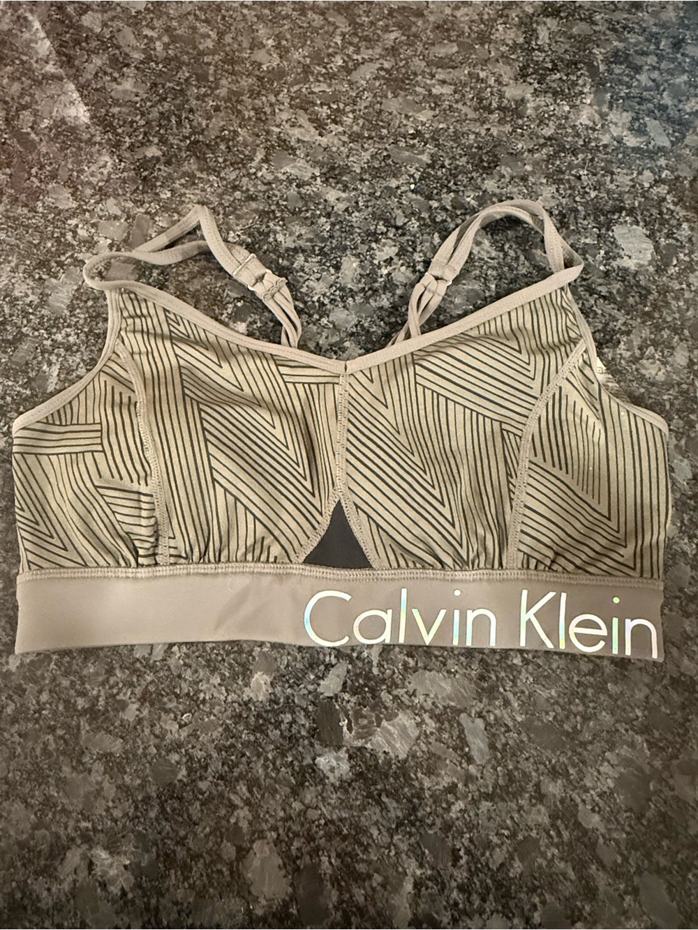 Calvin Klein sports bra with black geometric stripes